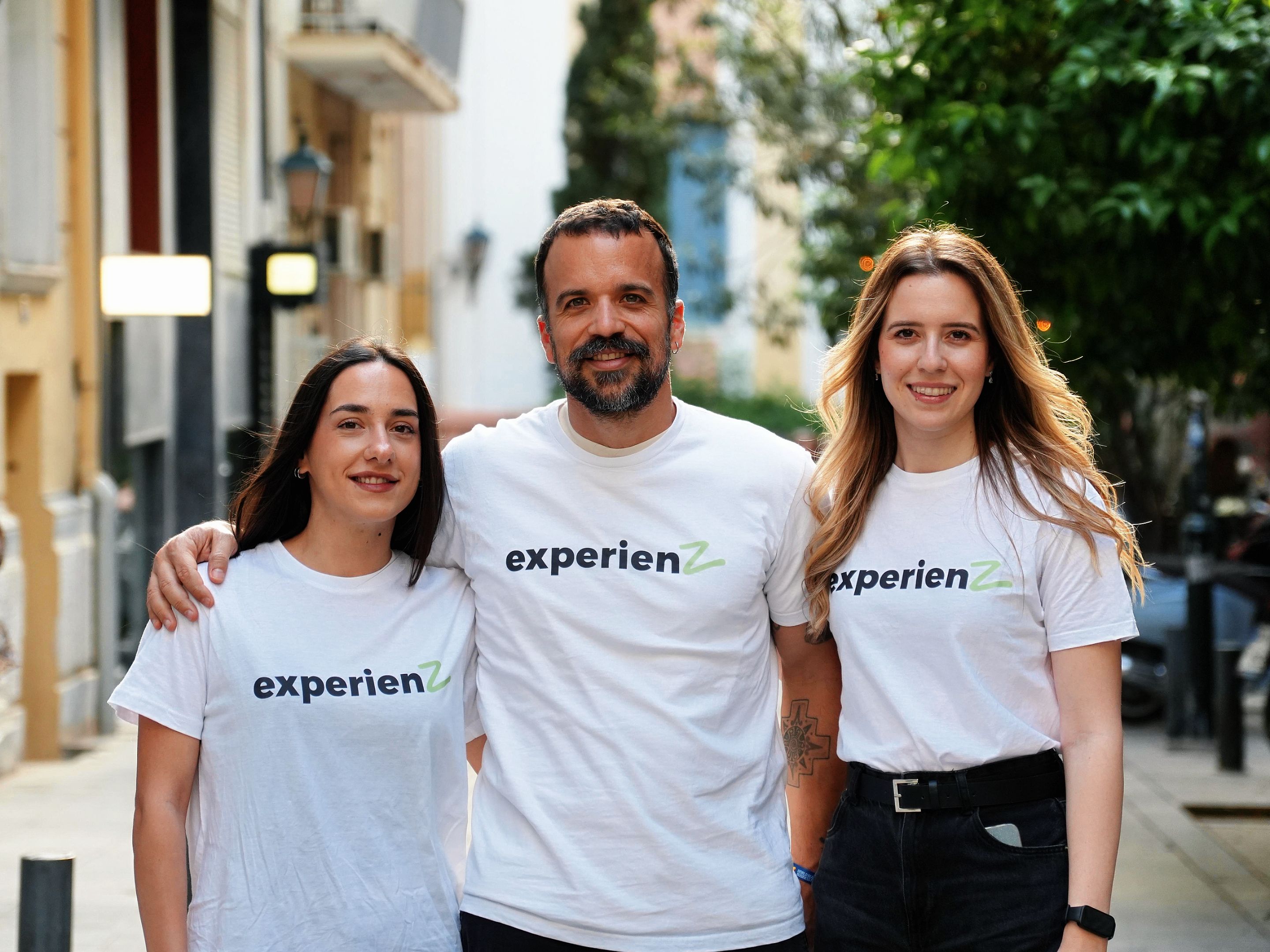 The ExperienZ founding team wearing branded shirts outdoors